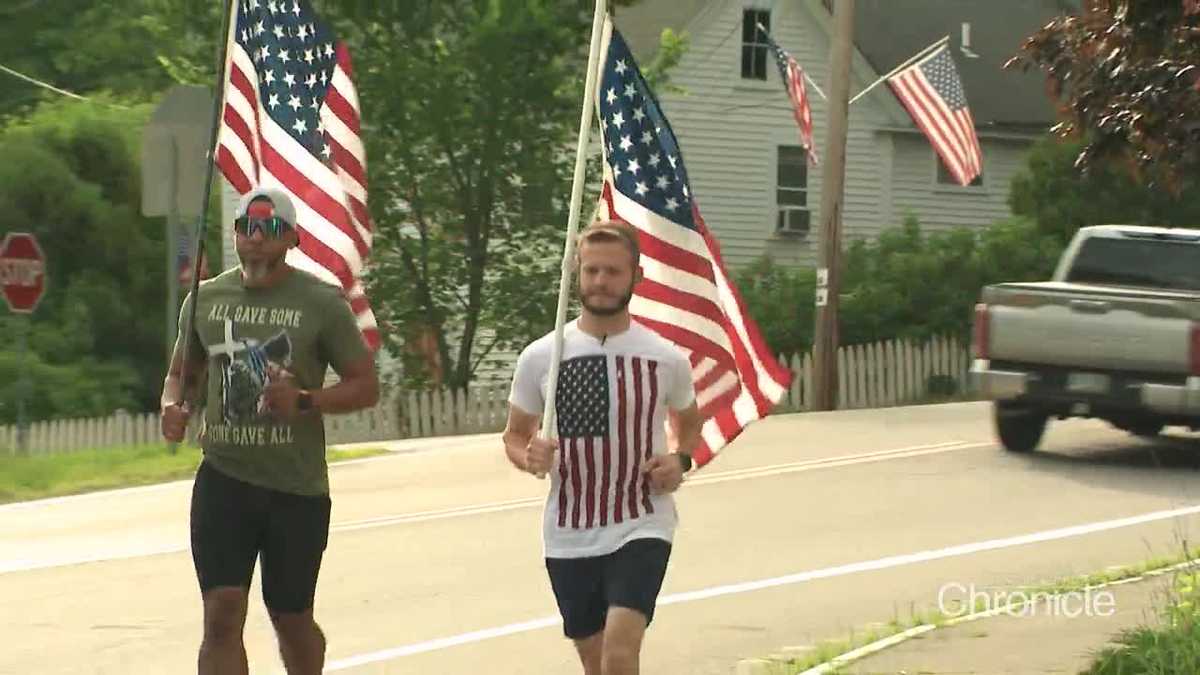 Pair of ultramarathoners run on patriotic holidays in New Hampshire while holding American flags