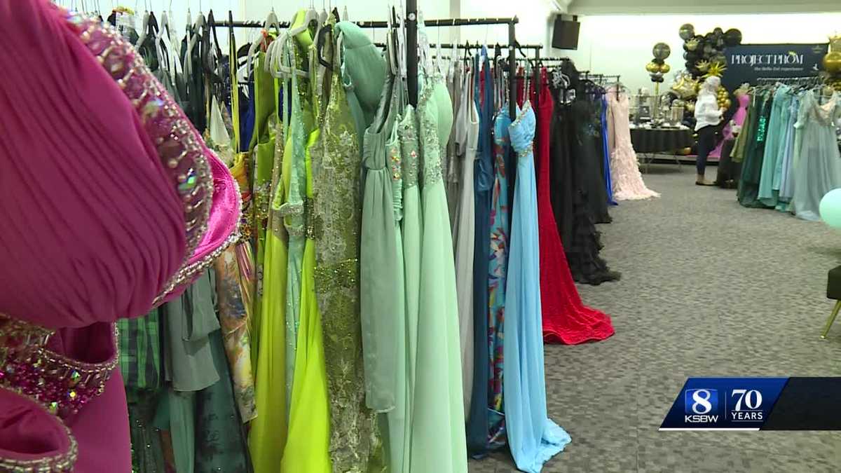 Project Prom holding prom dress and suit giveaway event