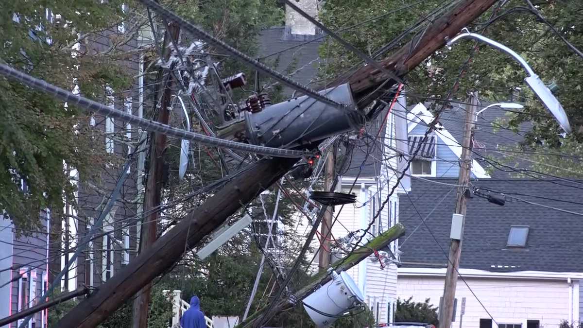 Strong wind gust rips down utility poles outside homes