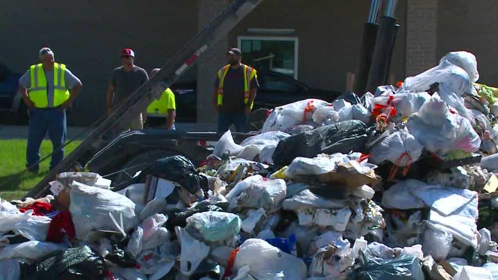 Garbage truck driver dumps pile of trash on east Des Moines street to avoid fire