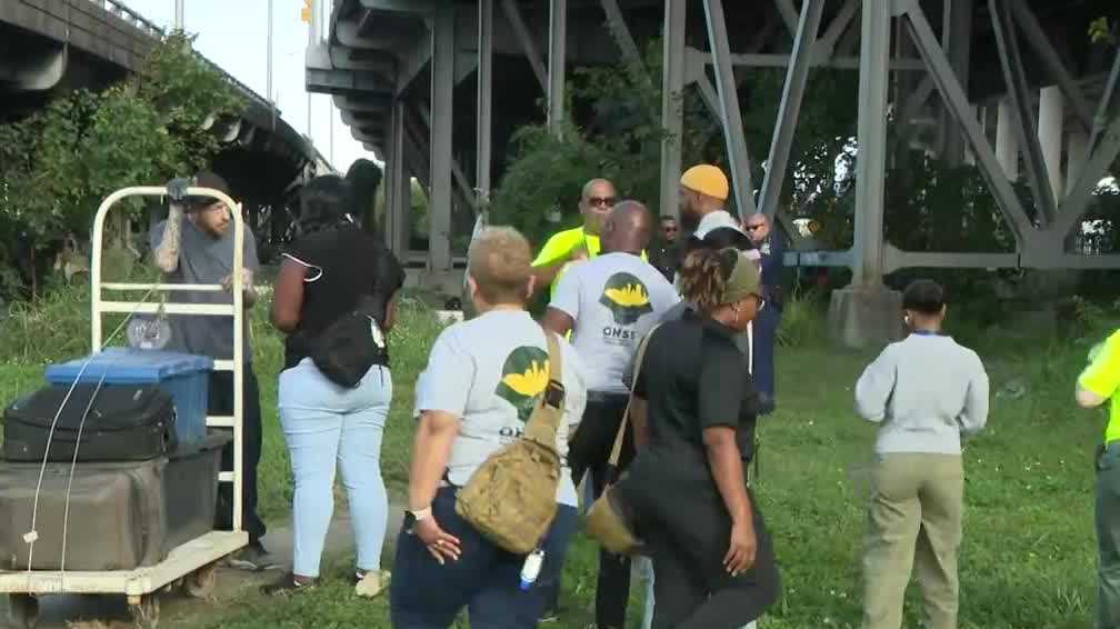 Massive cleanup underway at homeless encampment after fire damages on-ramp to West Bank