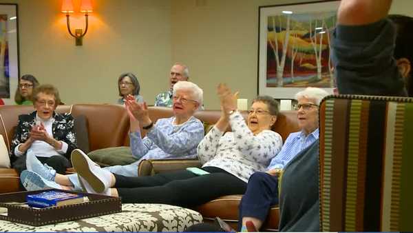 senior living community cheers on iowa hawkeyes in championship game