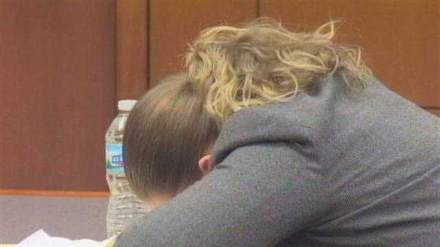 Mother accused of leaving son in hot car breaks down