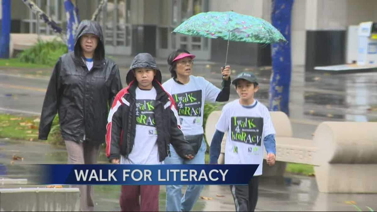Despite rain, hundreds come out for Literacy Walk