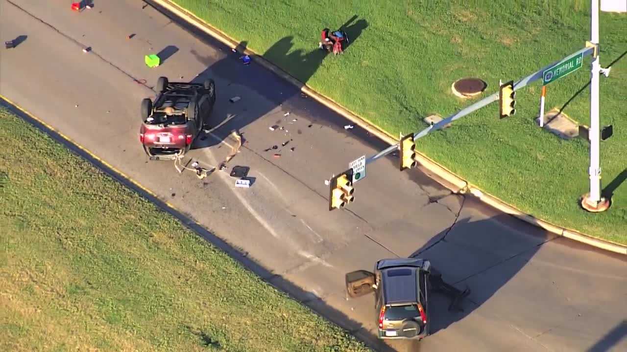 Police and EMSA respond to damaging rollover crash at busy northwest OKC intersection