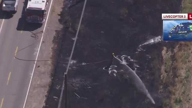 Crews battle grass fire along Garden Highway in Sacramento