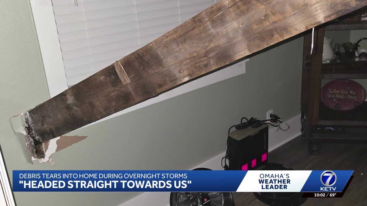 Severe storm debris tears holes into Iowa family's home