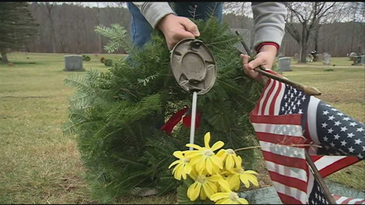 Holiday wreaths placed on veterans' graves