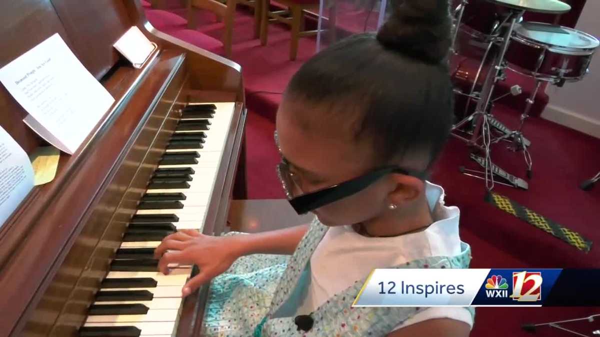 girl playing the piano