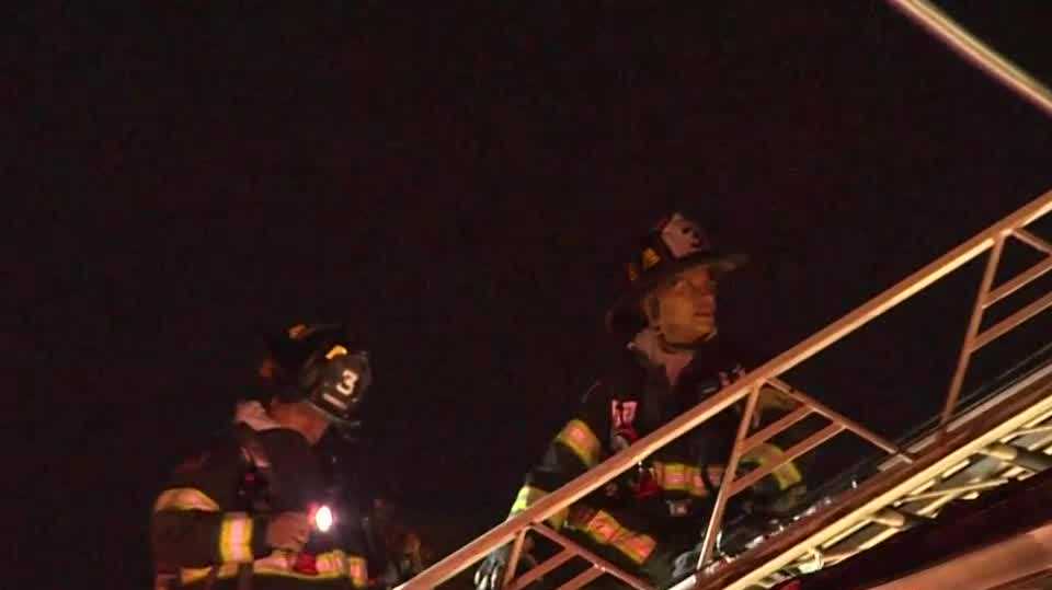 Crews battle Somerville house fire