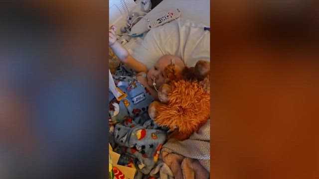 'A true Christmas miracle': Michigan troopers drive 600 miles to deliver gifts to toddler battling cancer