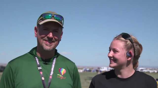 13-year-old pilot in training learns the ropes from dad during Albuquerque hot-air balloon festival