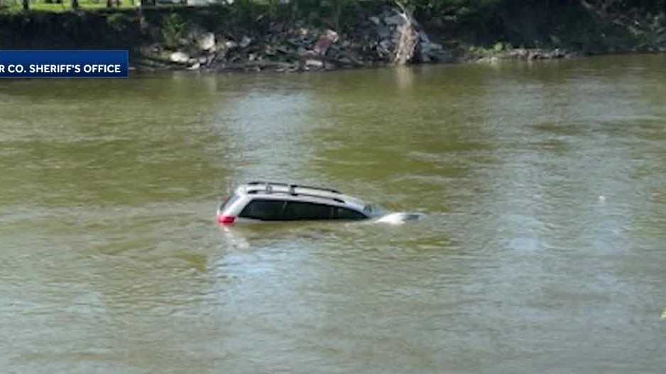 Multiple agencies work together to rescue woman from van submerged in ...