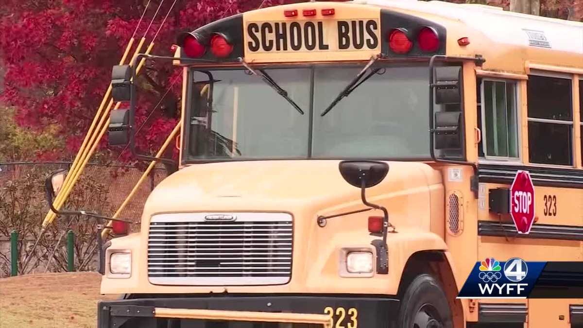 Family hit by car while waiting for school bus, school spokesman says