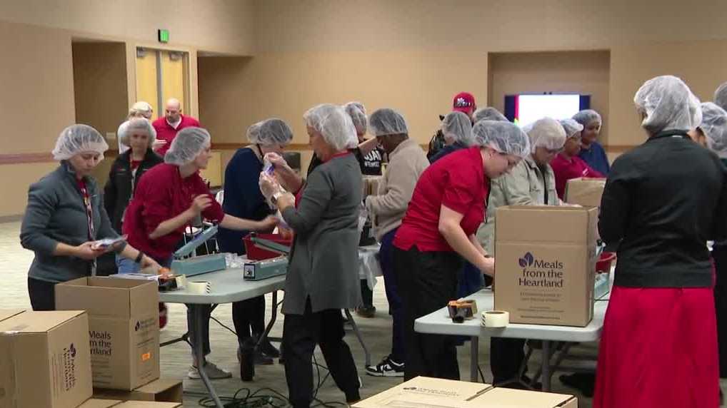 Volunteers at University of Nebraska Medical Center pack thousands of meals