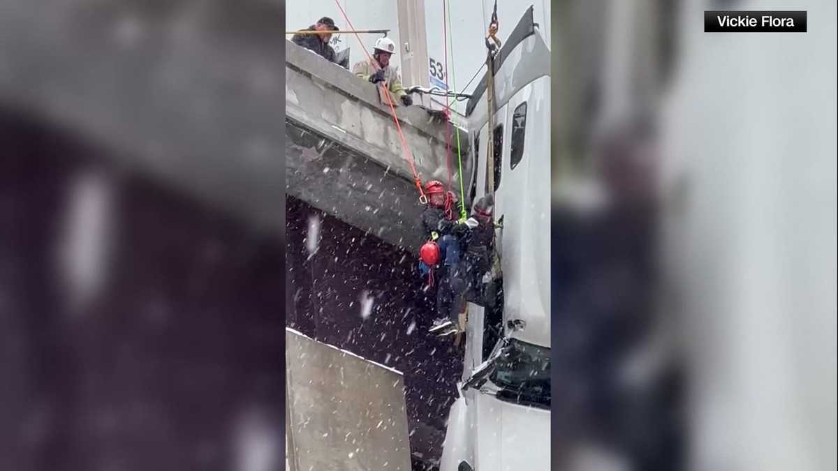 Emergency crews rescue driver from tractor-trailer dangling off West Virginia bridge