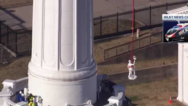 VIDEO: Louisville Water Tower statues return, lowered by crane