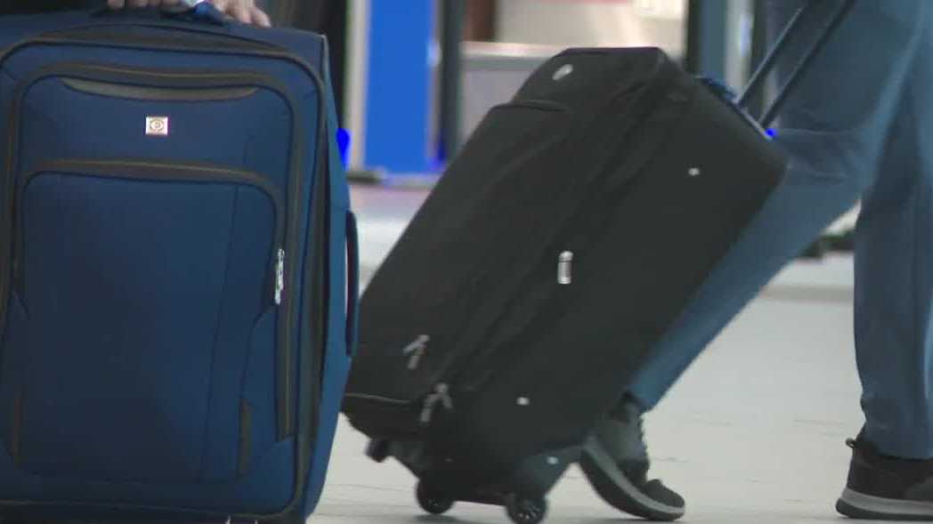 Holiday travelers arrive at Manchester-Boston Regional Airport ahead of snow