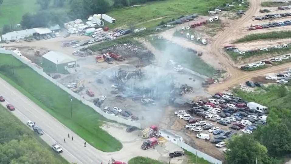One injured in large fire at central Iowa salvage yard; DNR investigating fuel spill