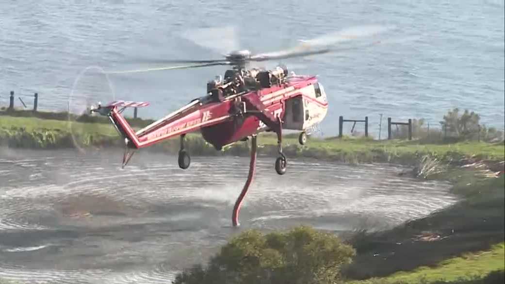 Big Sur crews and Chinook helicopter battle Timber Fire with vital ranch pond
