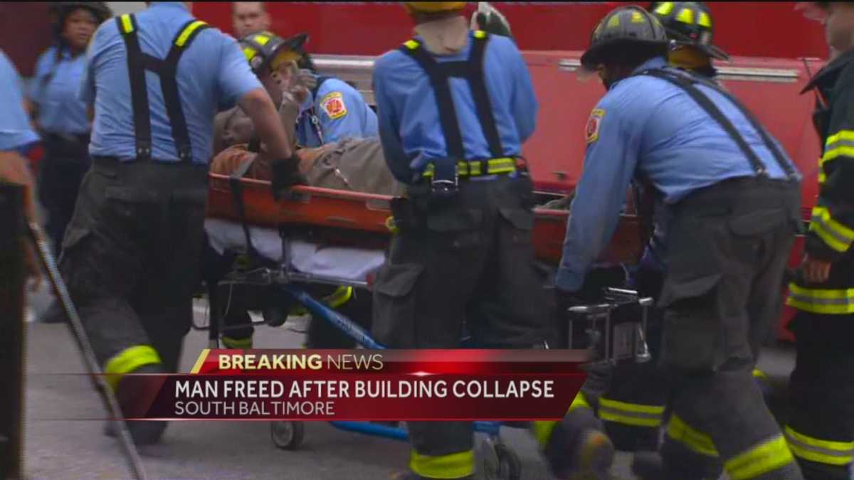Crews rescue man trapped in building collapse