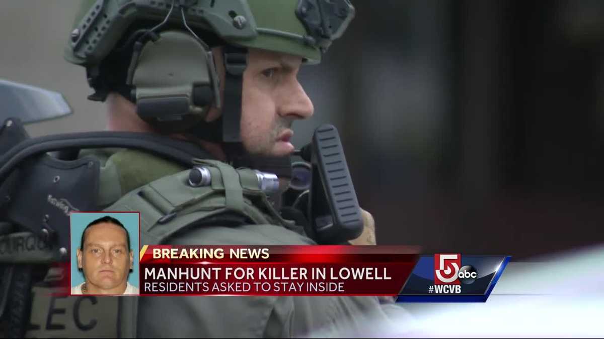 Heavily armed officers search neighborhood for suspected killer