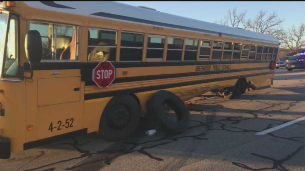 Car collides with Greenwood school bus