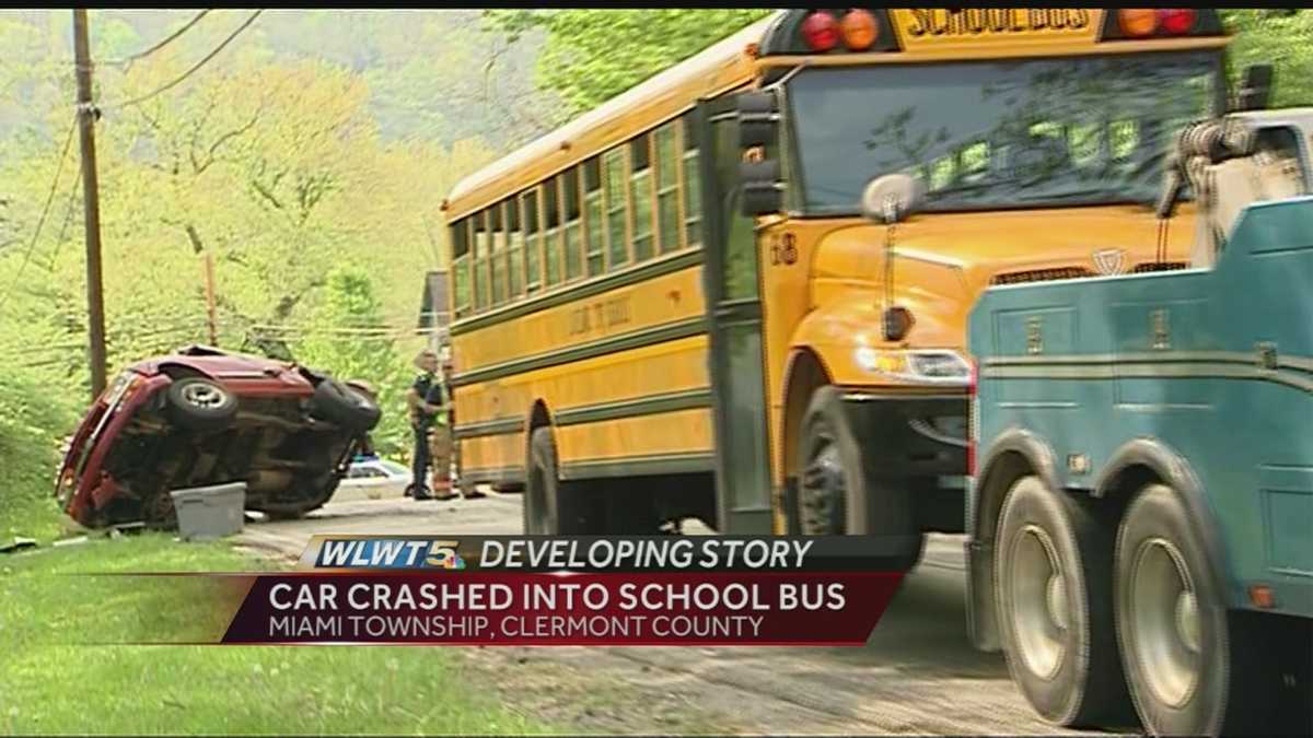 Adult, toddler injured in crash involving car, school bus