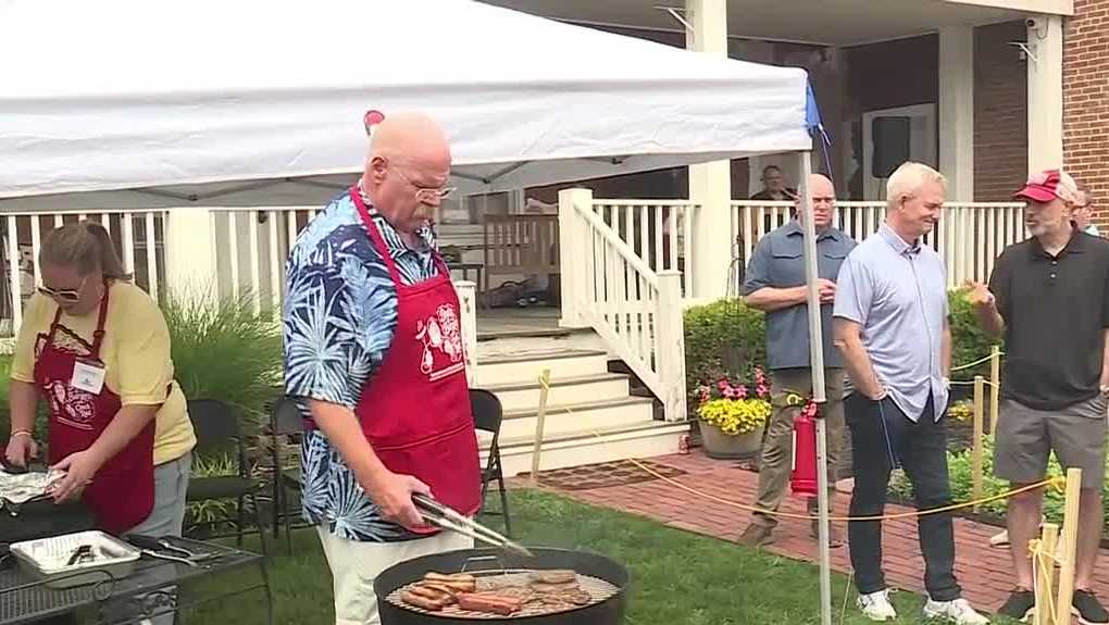 Andy Reid grills burgers and brats in Westport fundraiser for historic Kansas City home