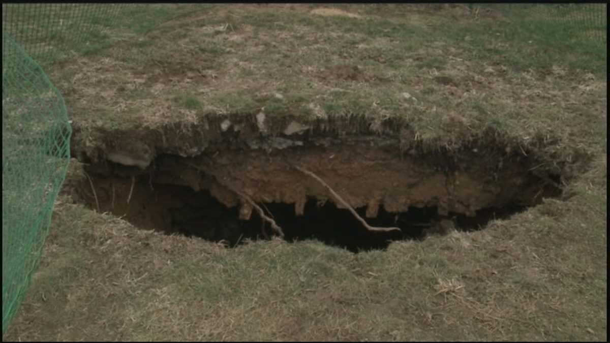 Backyard sinkhole uncovers underground structure in ...