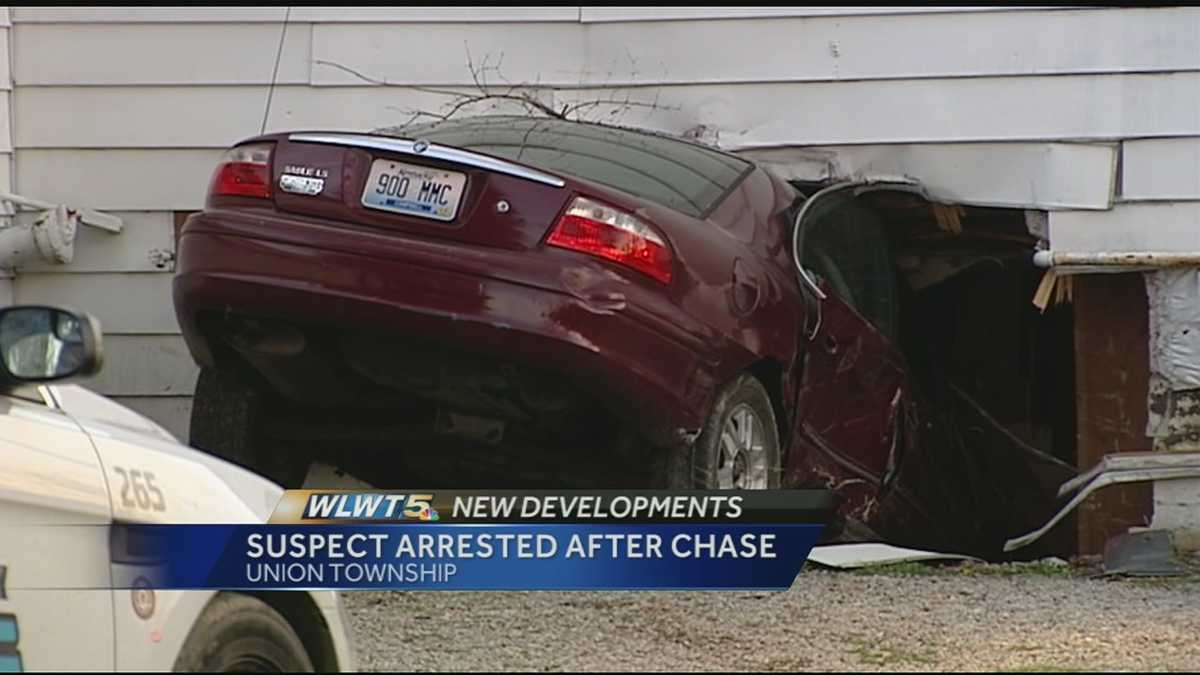 Driver charged after chase ends with car in house