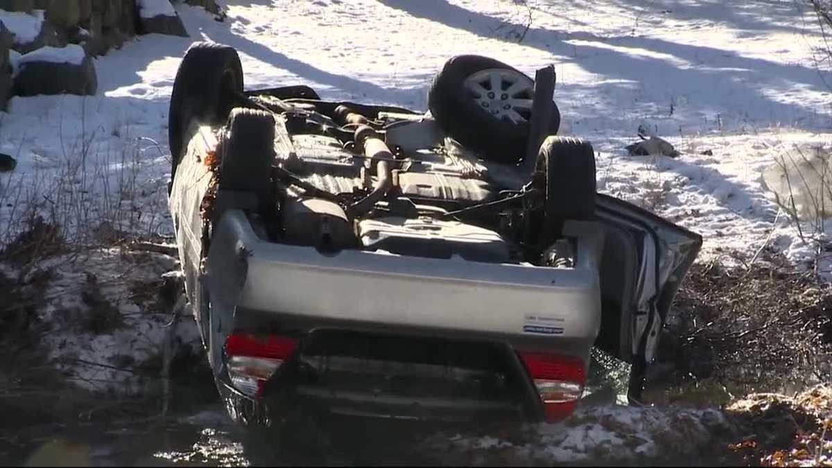 Car lands upside down in stream