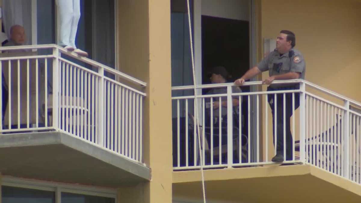 Officers stop woman from jumping off balcony, officials say