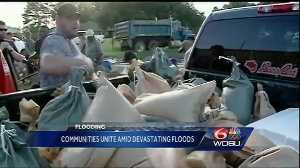 Volunteers from all over step up to help flood victims