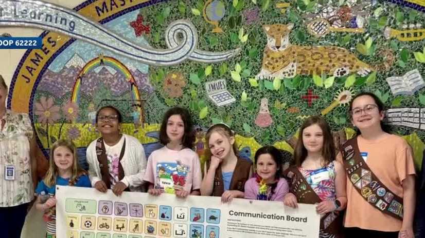 Merrimack Girl Scouts use cookie money to install communication banners at school playgrounds