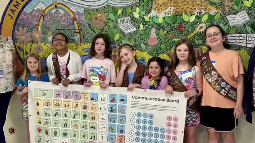 Merrimack Girl Scouts use cookie money to install communication banners at school playgrounds
