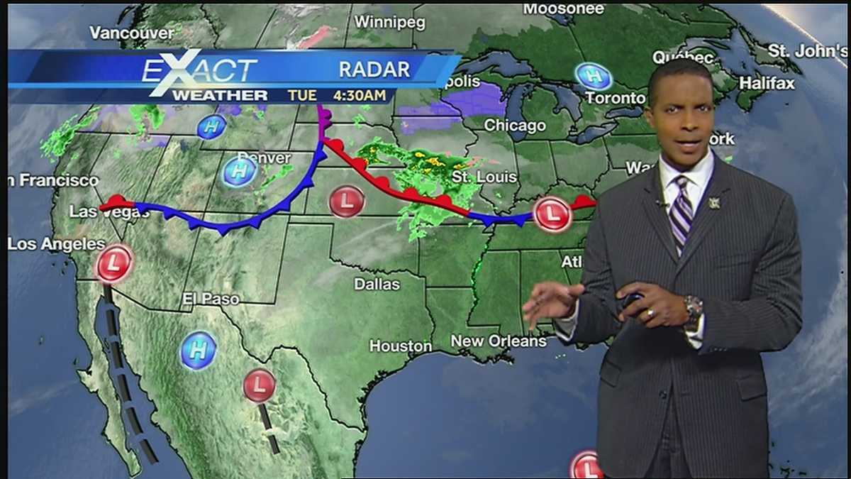 Partly to mostly cloudy and mild day with a few spotty showers