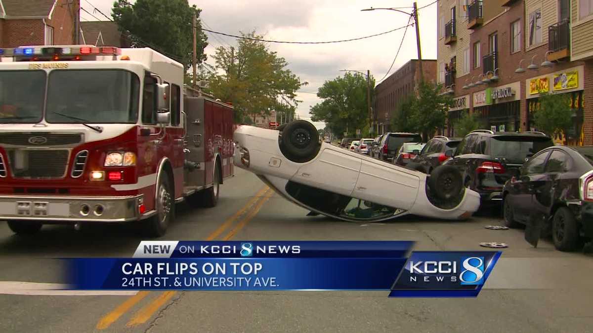 Driver recovering after car flips over in busy street