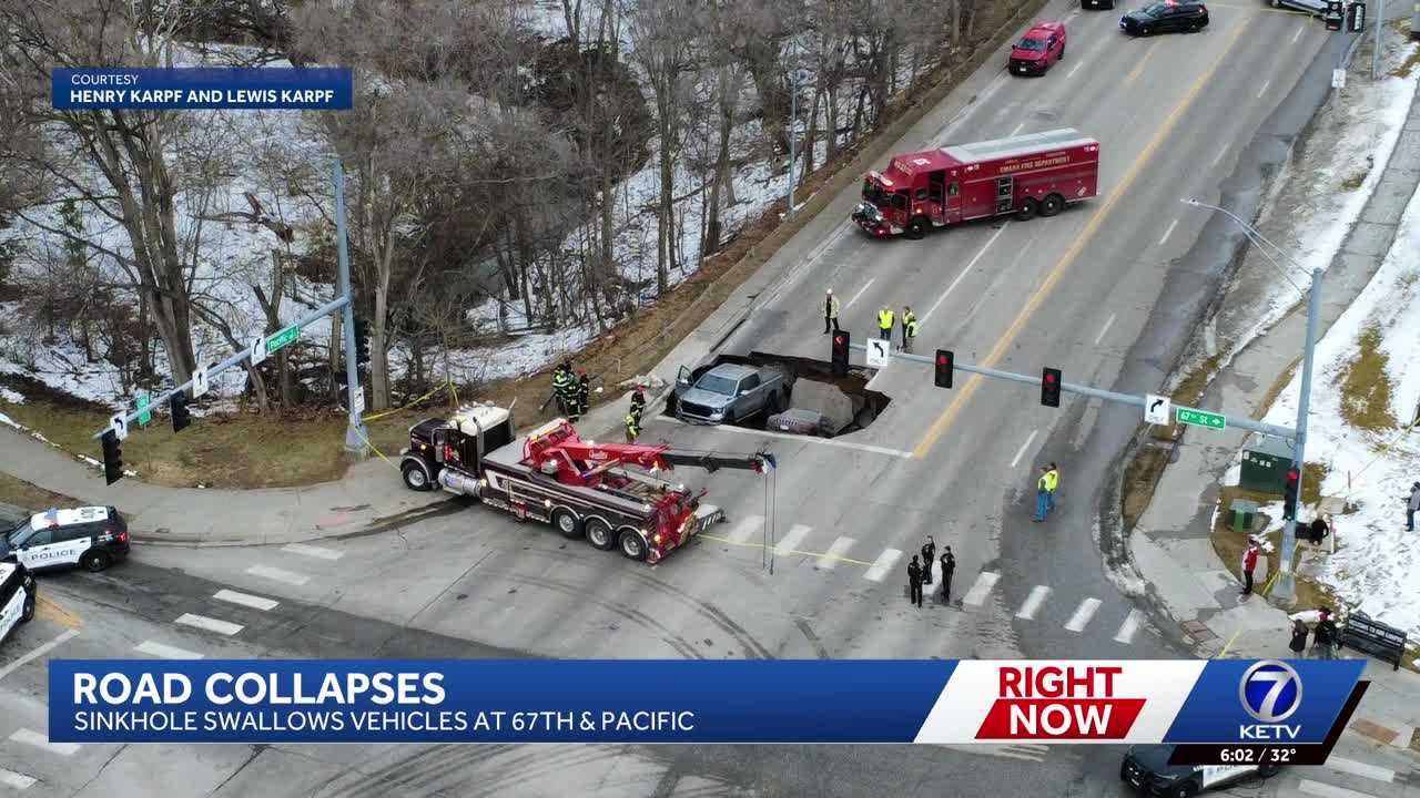 Omaha officials investigate what caused water main break, sinkhole that trapped two vehicles