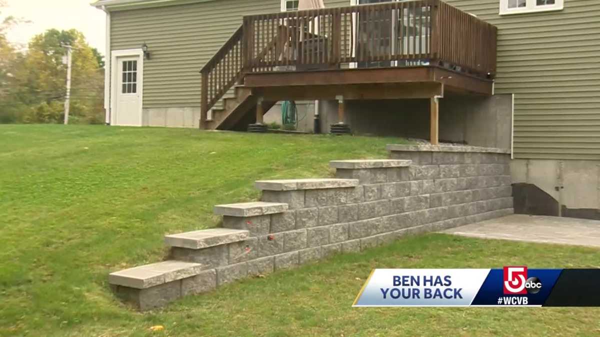 Family discovers newly constructed backyard wall cracking, crumbling