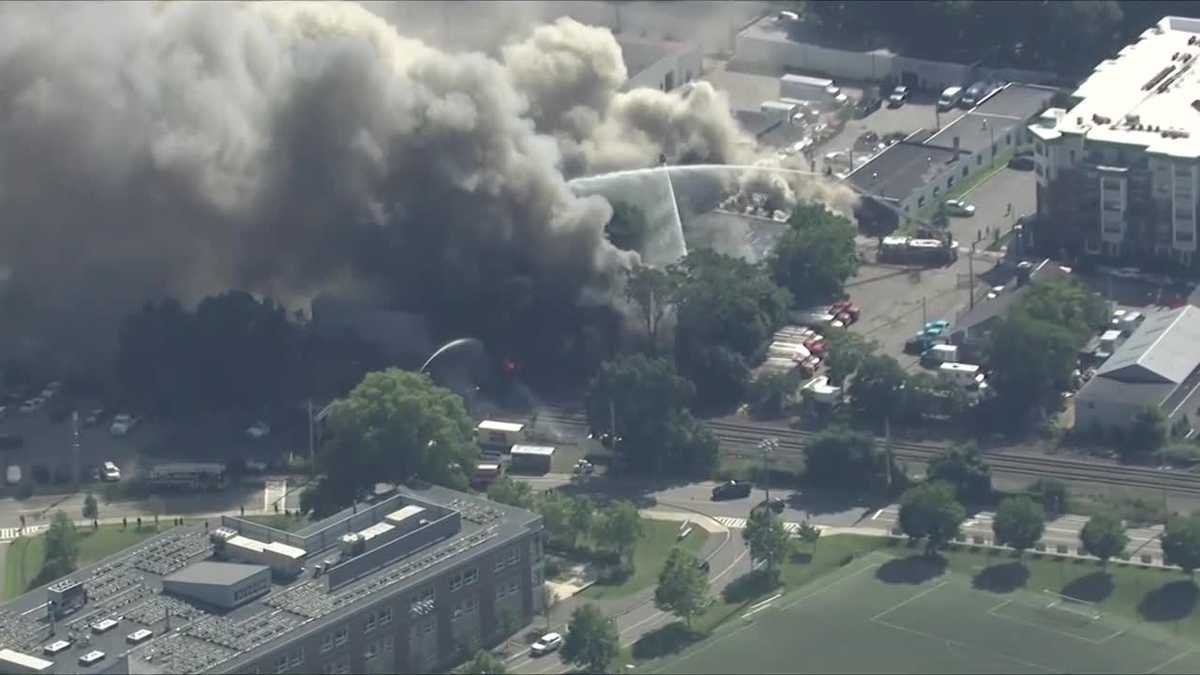 Large fire sends thick, black smoke over Mass. city