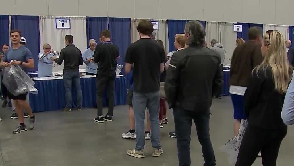 Runners pick up race packets ahead of the Kentucky Derby Festival miniMarathon, Marathon