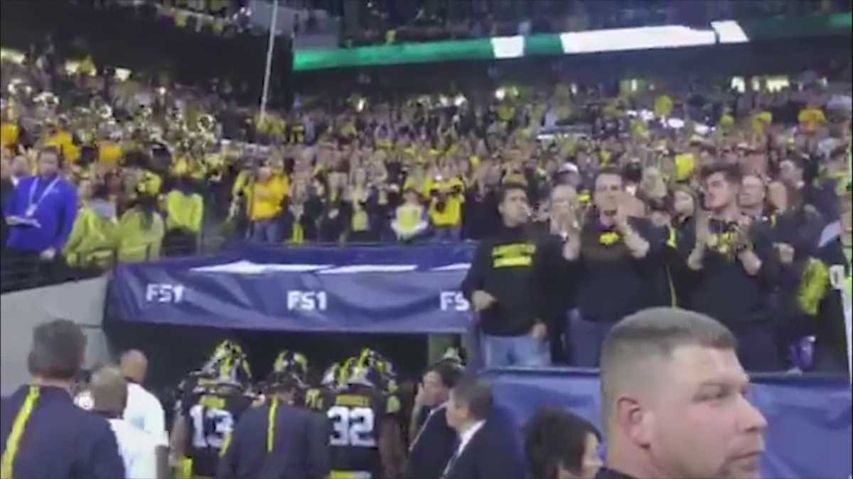 Fans salute the Hawkeyes