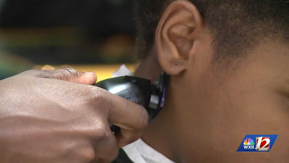 ‘It helps boost morale’: Burlington families prepare for school with free supplies and haircuts