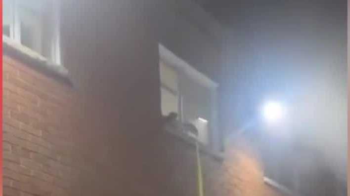 VIDEO: Baby rescued from second story of burning apartment building