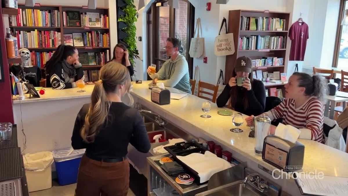 Owner of Portsmouth bookstore the also features bar carries on family legacy