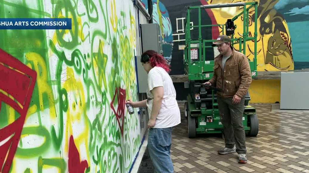 Students work with artist on mural in Nashua