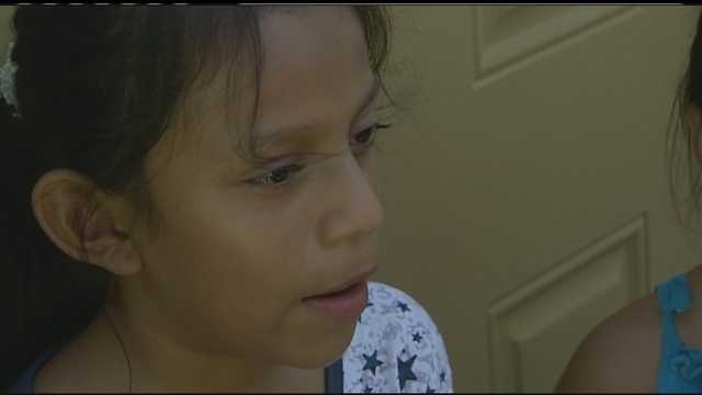 Mother robbed in front of 3 children, blackmailed