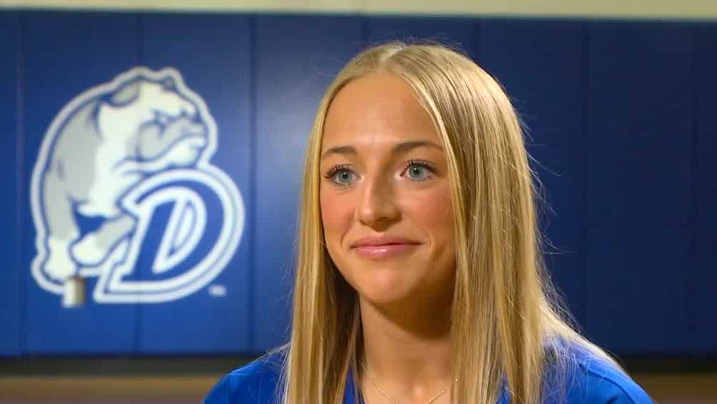 Drake's Katie Dinnebier balancing hoops with books