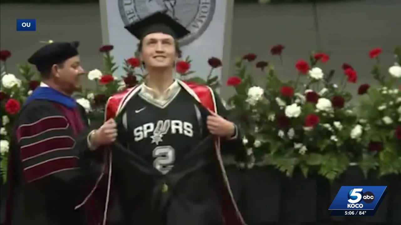 'All friendly banter': OU graduate flashes Spurs jersey under graduation gown while walking stage
